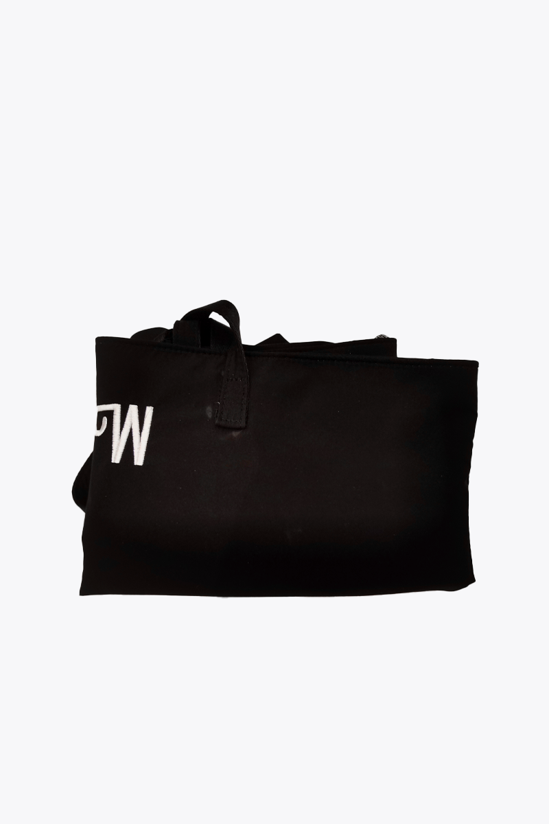 A folded Free Gift Urban Slate Waterproof bag in black with a looped handle and partial white lettering, shown against a plain white background for organized, on-the-go convenience.