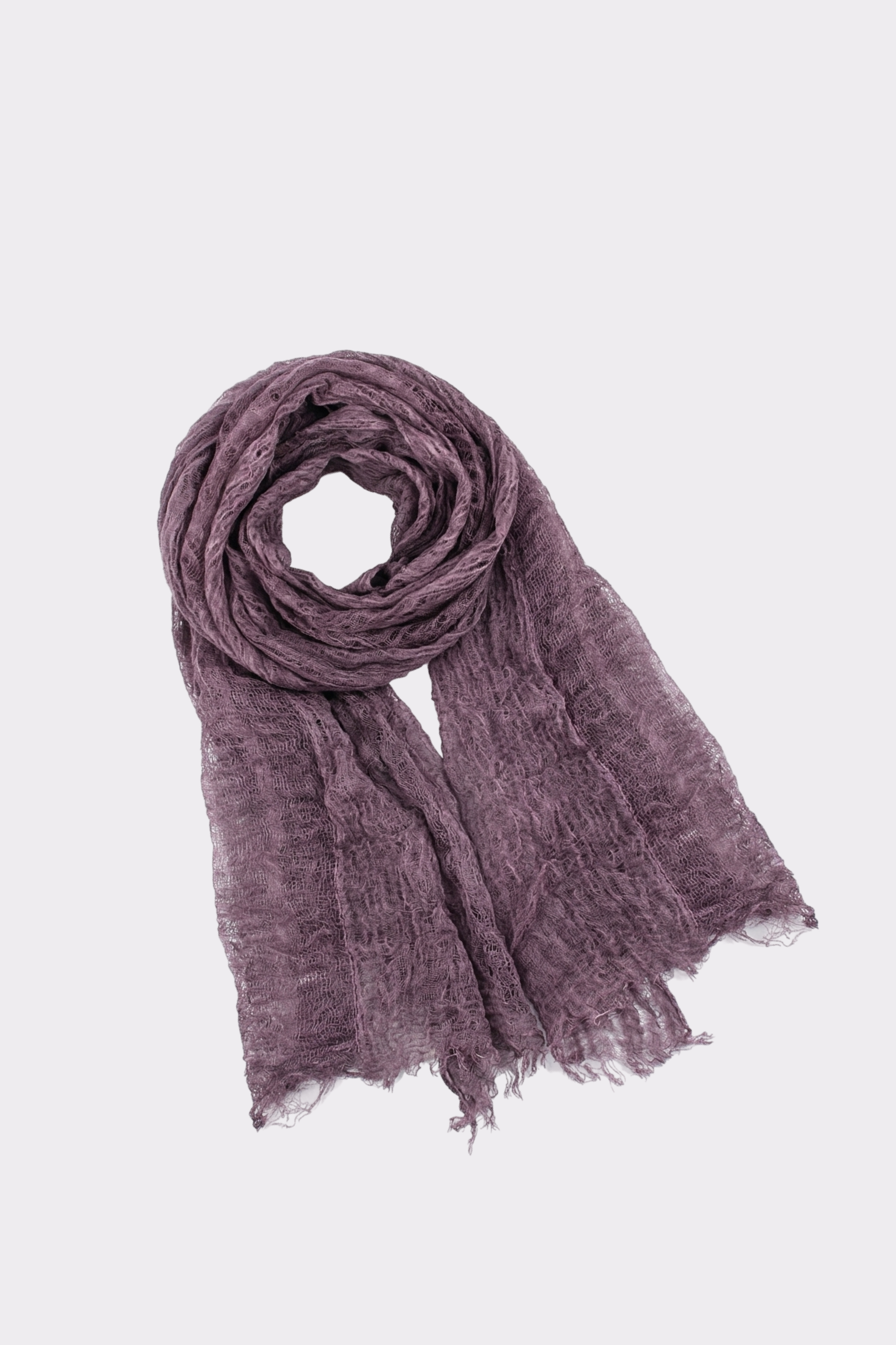 The Lightweight Linen Scarf, in crinkled purple linen with a textured finish, is shown laid flat with one end coiled on a plain white background—a versatile accessory for all seasons.